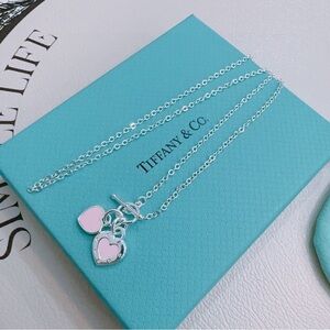 Elegant Tiffany & Co. Silver Necklace with Pink Heart Charms